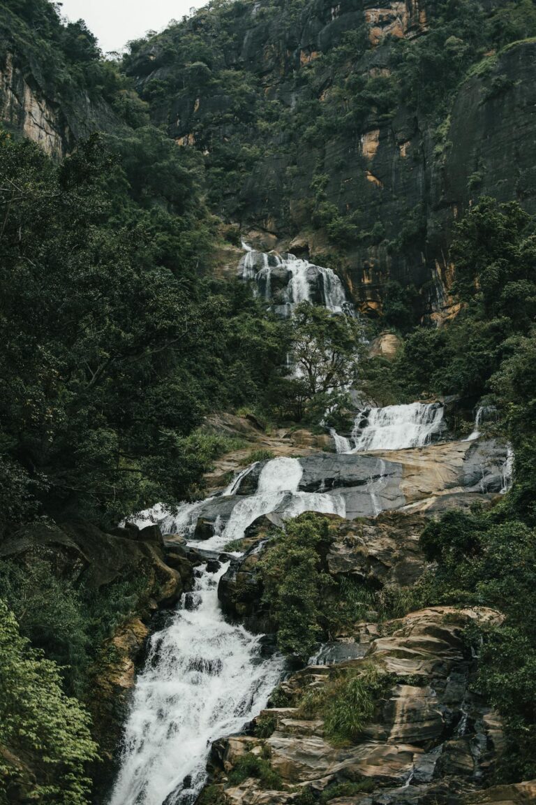 Explore the breathtaking waterfall cascading through lush greenery in Galle, Sri Lanka.